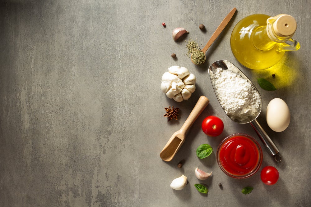 Above view pizza ingredients on a flat surface. 