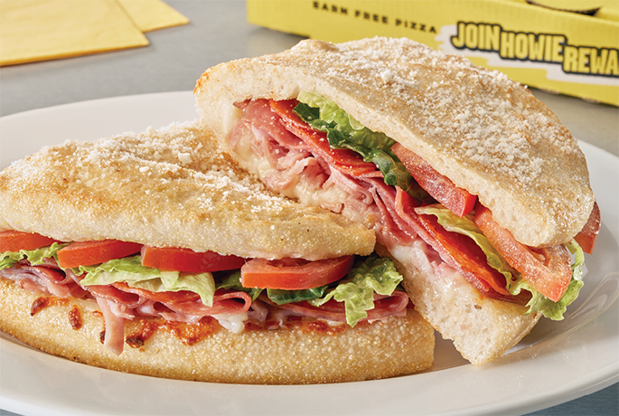 Sub sandwich with meat, lettuce, tomato