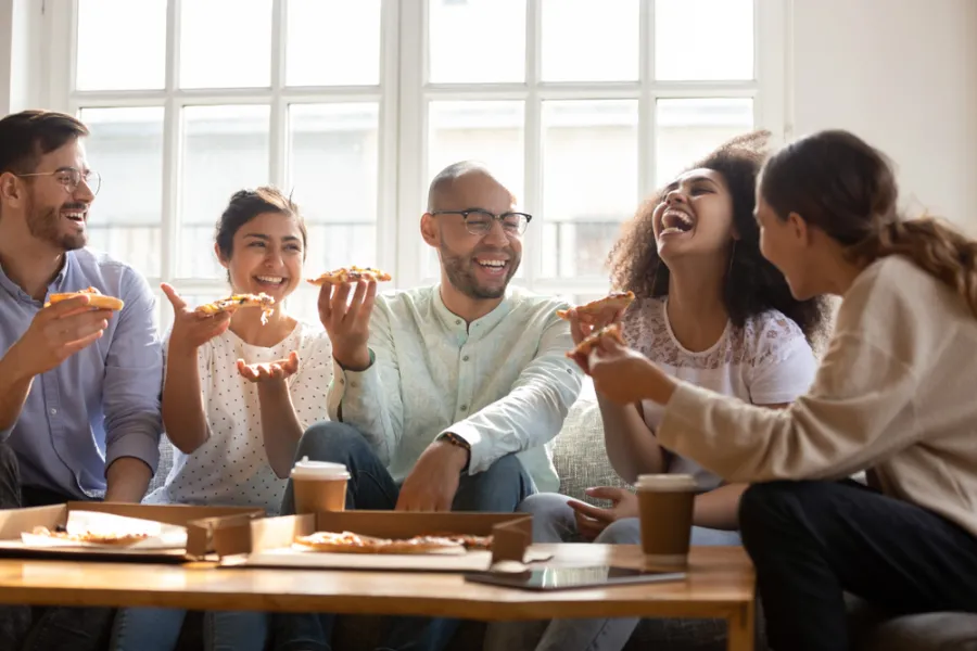 college students enjoying Hungry Howie's pizza delivery 