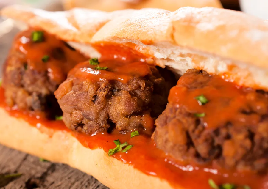 A meatball sub with bits of parsley on top form Hungry Howies